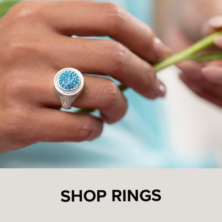 Woman wearing ring with aqua dot